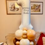 Air filled balloon stack .White number one personalised balloon with ivory and mocha brown balloon in base